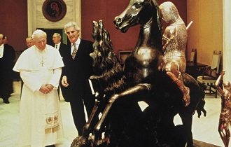 Beniamino Levi, founder of the Dali Universe, presenting the Salvador Dali bronze sculpture Saint George and the Dragon to Pope John Paul II.