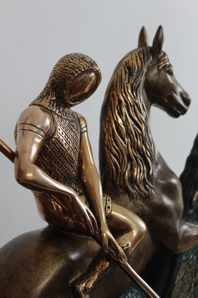 Detail of the heads of St. George and the horse in the limited edition Salvador Dali sculpture.