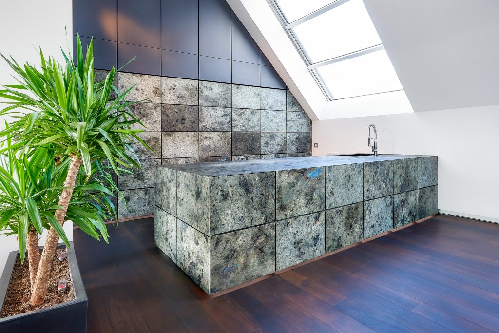 modern kitchen in natural stone, in this picture with all drawers and panels closed